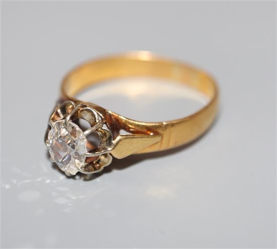 A yellow metal and claw set solitaire diamond ring, (stone a.f.), size P.